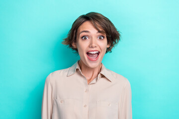 Closeup portrait photo of young astonished shocked girl wear stylish formal beige shirt excited unexpected open mouth salary isolated on cyan color background