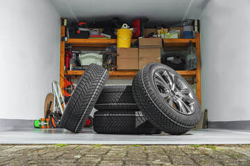 Private garage background. Car tire set in private garage.