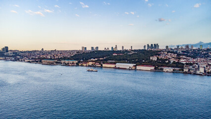 Panorama image Skyscrapers of istanbul behind the Bosphorous, financial district of Turkey next to a big bridge