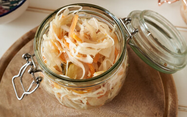 A glass jar of fermented cabbage and carrots