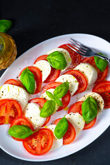 Tomato with mozzarella and basil