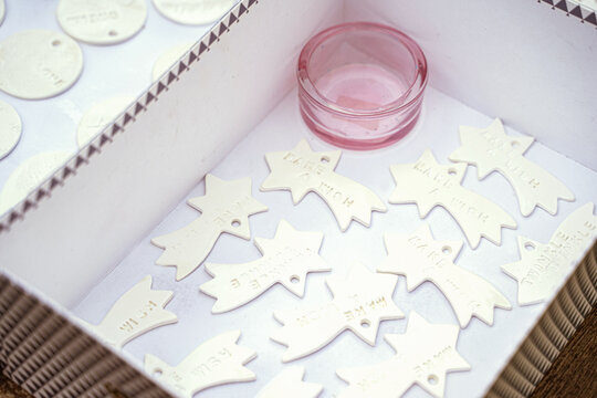 Comet or star shaped handmade ceramic products in box on christmas market sale outdoors. Home decor, presents with text: twinkle, make a wish. Handcraft artist class workshop, small business, hobby