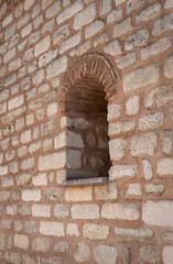 old window in the stone wall. historic building.