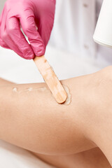 Fototapeta premium Laser depilation or photoepilator process on a woman leg.