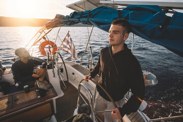 Young man at the helm 