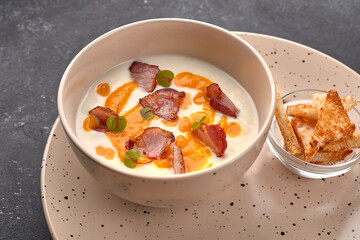 Cream soup, cauliflower with bacon, and croutons