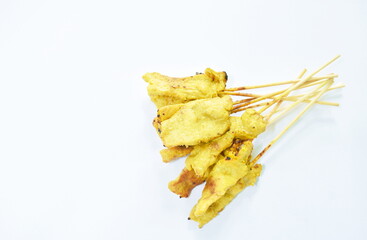 Naklejka premium grilled pork satay stabbing in wooden stick Indonesian food on white background