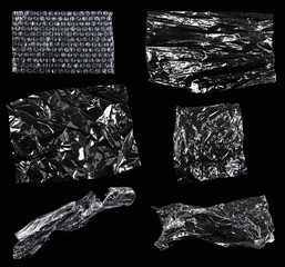 Transparencies. Transparent plastic film texture isolated on black background. Set of plastic packaging materials textures