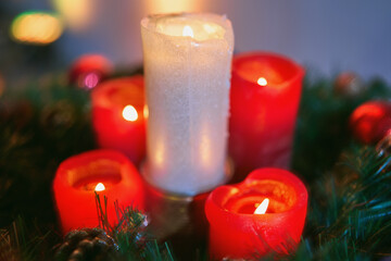 Red advent candles. Christmas decoration with christmas candles burning.