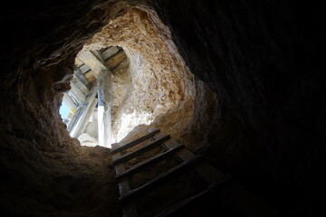 entrance of a silver mine in potosi, bolivia. 