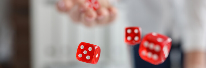 On the table are red dice and green casino chips