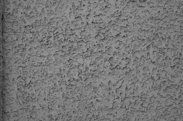Gray concrete stucco wall, uneven grungy vintage background close-up, grunge texture.