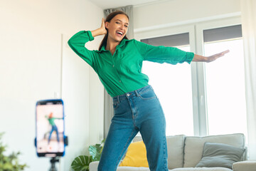 Fototapeta na wymiar Joyful Blogger Woman Making Video Dancing At Home