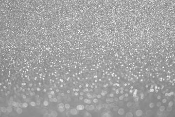Abstract Glitter Background. Silver Texture Sparkling Shiny Paper for Christmas Holiday. Seasonal Wallpaper Decoration. Greeting and Wedding Invitation Card Design. Sparkle Lights and Bokeh Backdrop.