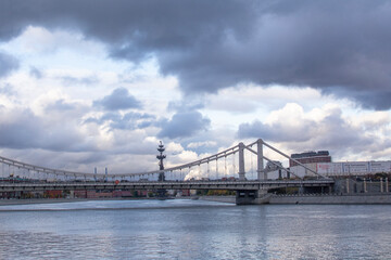 Moscow, Russia - october 5, 2022: Hanging Crimean bridge over the Moskva River. Bridge structure consists of two pairs of pylons suspended on chains with a length of 297 meters