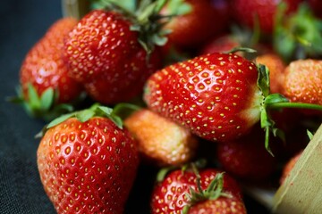 Fruit red ripe strawberries, several berries, close-up. Ecological products grown in the garden