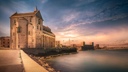 Fototapeta na wymiar Trani cathedral over the sea stunning sunset sky
