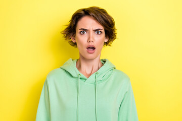 Close up photo of astonished adorable lady dressed green clothes impressed bad news stupid...