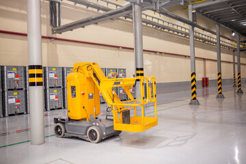 Forklift. telescopic lift. Pallet stacker equipment in warehouse. The loader works at the factory. Industrial technology enterprise.