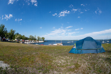 Tent set up on a campground near a marina at lake champlain