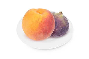 Figs and peach on a white plate on an isolated white background.