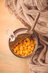 Open tin can, with corn, top view, selective focus, no people, close-up,