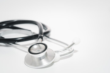 Close up Black stethoscope on desk. Health and care concept. copy space for text.