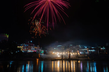 The Ganga River reflecting the festivities in the temples during the night.