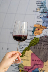glass of wine near map