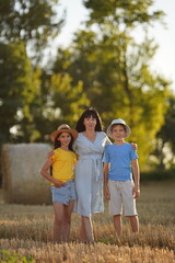 Incomplete family. Boy, girl and mother. A family without a father. Happy childhood in a single-parent family. Family holidays in nature. The concept of same-sex motherhood. Same-sex marriage.