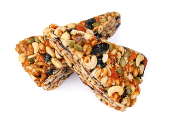 Kozinak from various nuts with dried fruits isolated on white background.