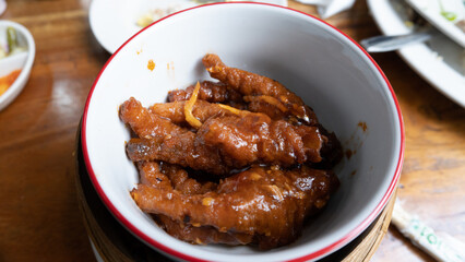 angsio or chicken feet cooked with a spicy red sauce that taste savoury. It can be easily found in chinese restaurant.