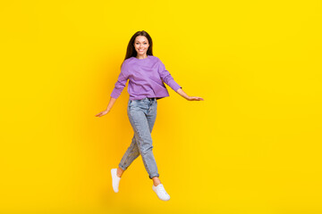 Fototapeta na wymiar Full length photo of cheerful energetic active lady wear trendy clothes good mood move empty space isolated on yellow color background