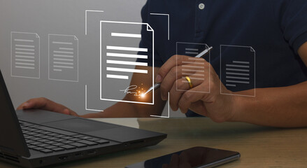Document management system concept, a businessman using a laptop and having folders and software...