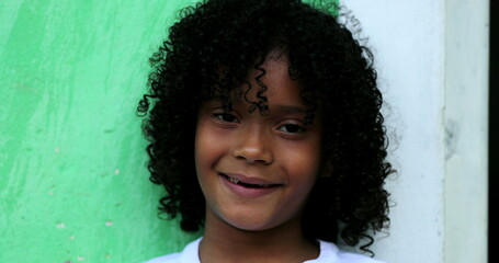Happy Brazilian little girl portrait. close-up hispanic African descent child