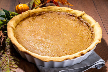 Traditional thanksgiving day american holiday pumpkin pie, traditional pastry cake on wooden table