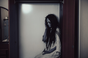 Portrait of asian woman make up ghost,Scary horror scene for background,Halloween festival...