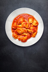 ravioli pasta fish stuffed tomato sauce fresh dish meal food snack on the table copy space food background 