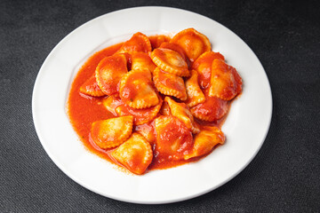 ravioli pasta fish stuffed tomato sauce fresh dish meal food snack on the table copy space food background 