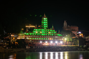 The Ganga River reflecting the colors of the temples at night.