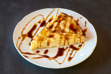 plate with a slice of caramel cheesecake