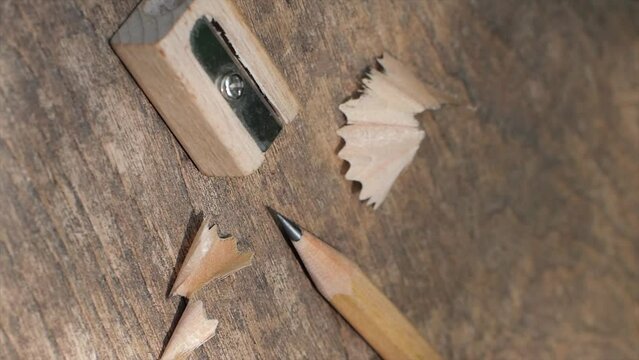 Wood grain pencil and sharpener on wooden background