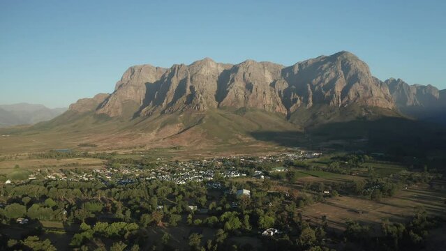 Aerial view over the green vineyards and rugged mountains of Banhoek and Franschhoek valley in Stellenbosch in South Africa