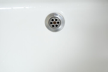 Top view clean white washbasin drain