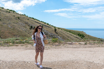 Hiker looking at the view at Calanques de Piana in Corsica, France