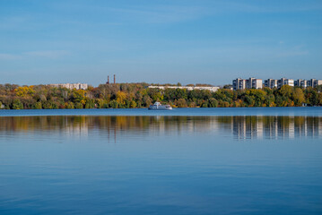 Fototapeta premium autumn lake water houses leaves yellow