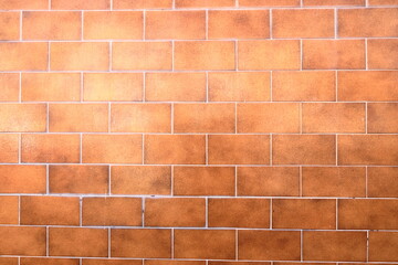 Old yellow brown tile wall texture background