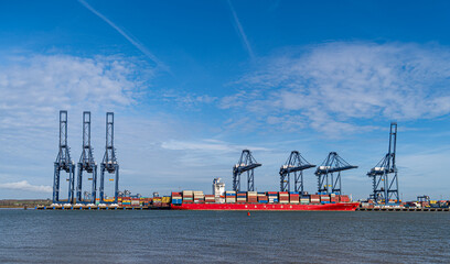 Large steel gantry container cranes in commercial shipping port