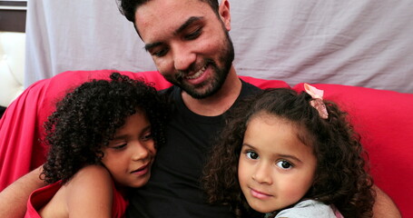 Latin people love and affection, daughters hugging father, hispanic brazilian ethnicity
