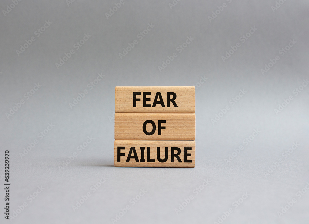 Fototapete fear of failure symbol. concept words fear of failure on wooden blocks. beautiful grey background. b